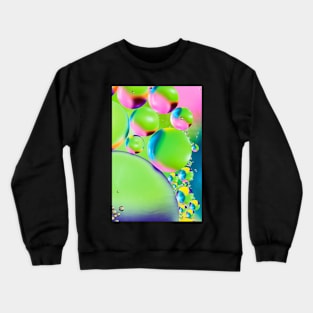 Colorful close up of oil drops in water Crewneck Sweatshirt